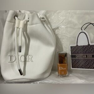 Dior White Drawstring Bag, Dior Nail Polish in Tutu, and a Dior Bag Car Freshie